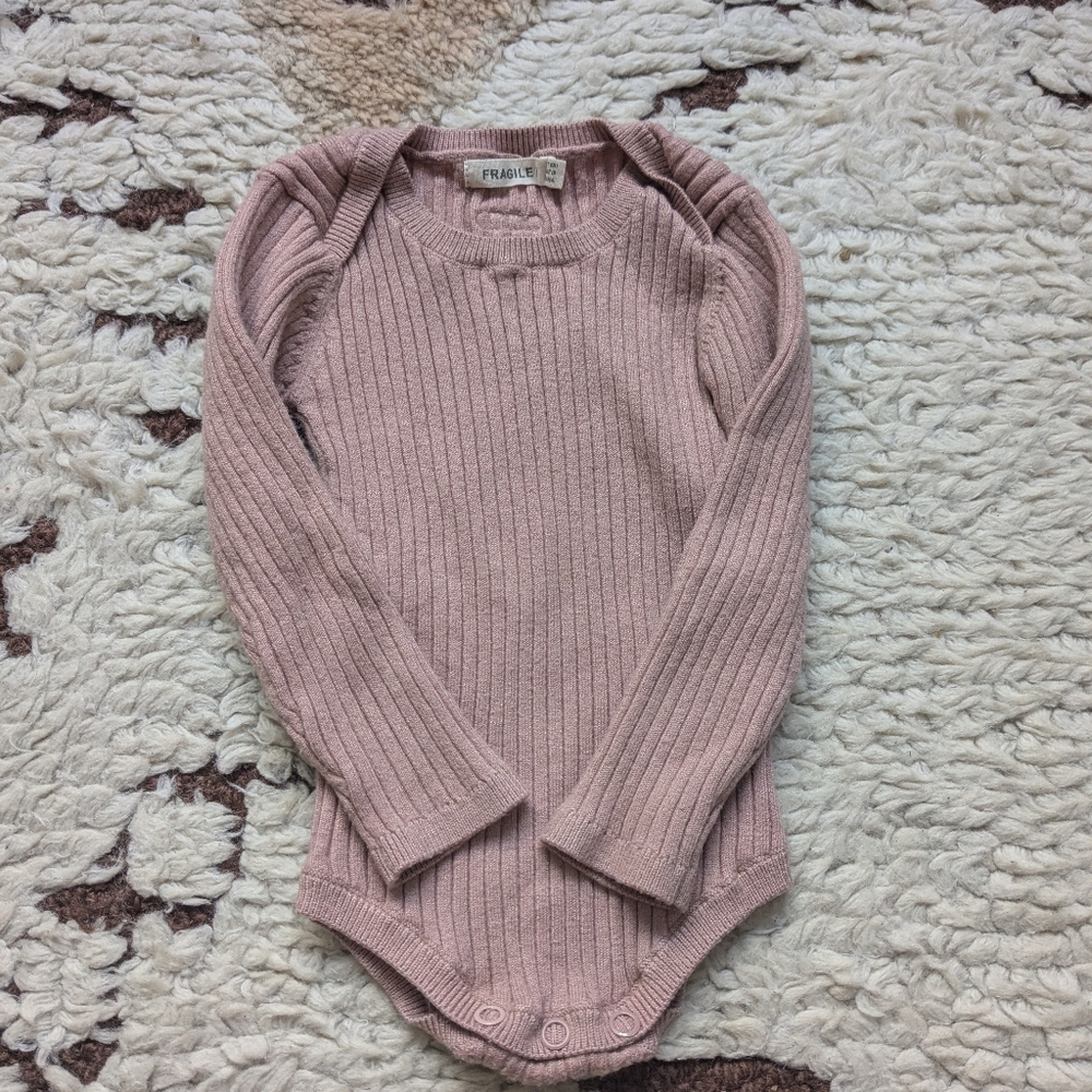 Fragile baby onesie